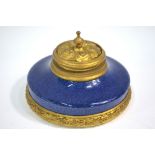 A Sevres circular porcelain inkwell with ormolu mounts, 13.5 cm dia.