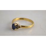 A 9ct ring set blue synthetic spinnel and six diamonds, 9ct yellow gold,