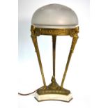 An ormolu Egyptian revival style triform table lamp with opaque glass shade,