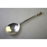 A Charles II silver seal-top spoon with oval bowl flattened stem and baluster finial,