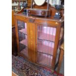 An Edwardian painted mahogany serpentine-fret display cabinet