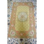An Aubusson rug, peach ground/pale yellow with rose and garland border,