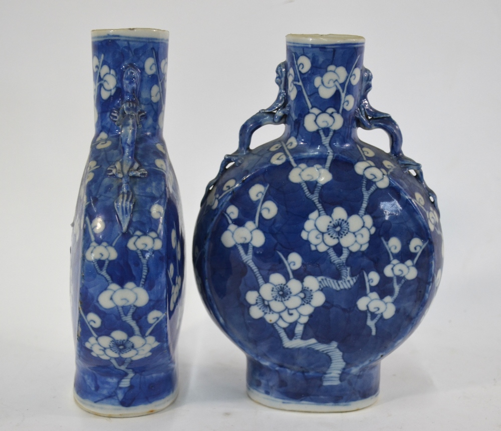 A pair of blue and white pilgrim flasks, each one decorated with a design of prunus in flower; 21. - Image 2 of 5