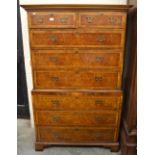 A walnut and crossbanded chest on chest of two short and six long drawers,