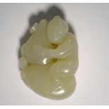 A small green jade figure of whitish hue, carved as a boy seated beside a bat on a large gourd, 4.