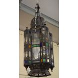 A large lantern with coloured glass, possibly Moroccan or North African,