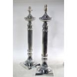 A large pair of electroplated reeded-column table lamps,