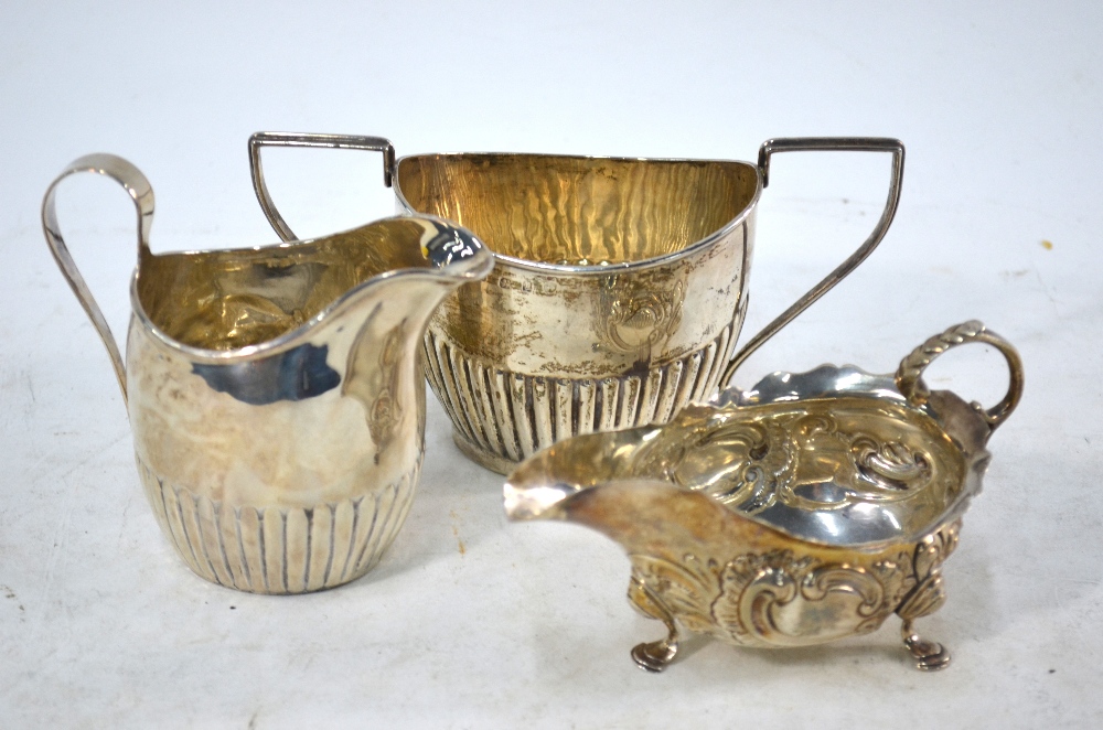 A George III silver half-reeded cream jug, Nathaniel Smith & Co.