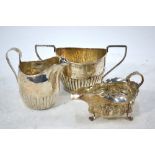 A George III silver half-reeded cream jug, Nathaniel Smith & Co.