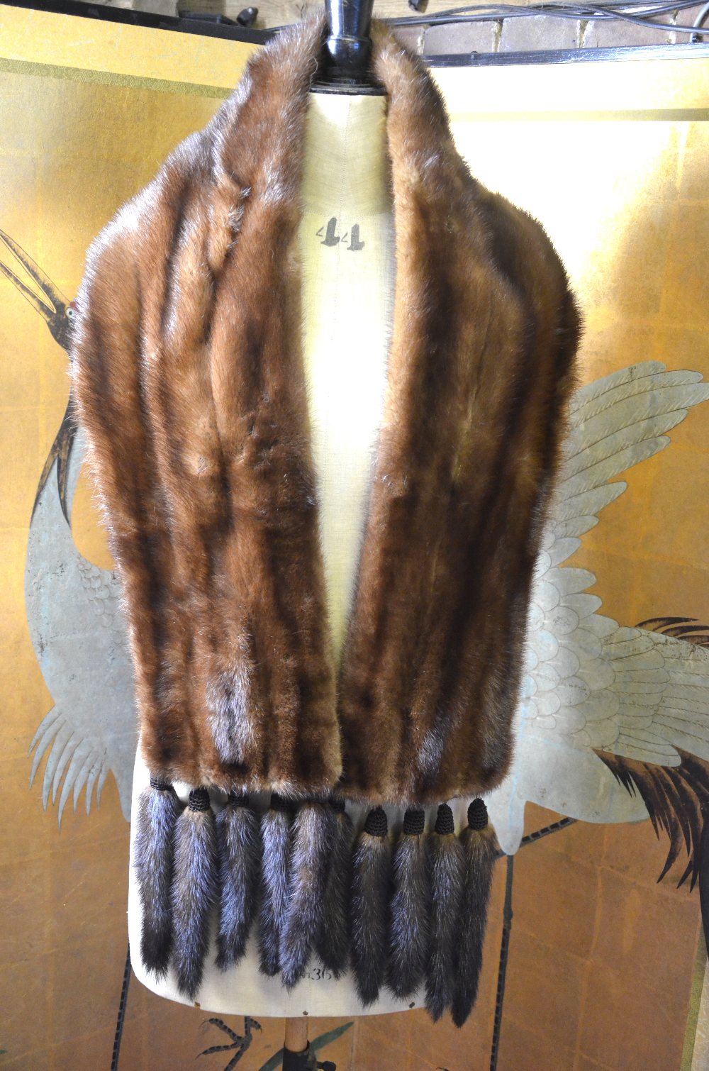 A mid brown mink fur stole, each end embellished with five tails, retailed by Eric's Furriers,