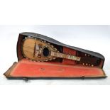 An Italian rosewood mandolin inlaid with mother of pearl and tortoiseshell,