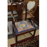 A 19th century mahogany carver chair with vase shape back plat and needlework seat