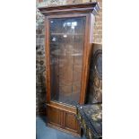 A late 19th / 20th century two part oak gun cabinet in the manner of Army & Navy,