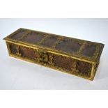 A Continental gilt brass glove-box with foliate-tooled leather panels and blue velvet lining,