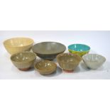 Seven Asian ceramic bowls or dishes, including: a yellow-ground,