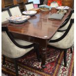 A mahogany extending dining table,