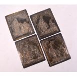 A set of four Burmese white metal rectangular plaques;