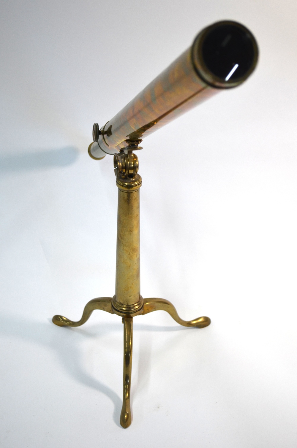 A 19th century brass tube table top telescope on folding tripod stand,