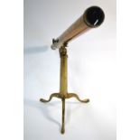A 19th century brass tube table top telescope on folding tripod stand,