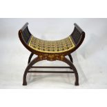 An Edwardian ivorine and satinwood inlaid stool of cradle form,