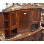 An Edwardian mahogany, rosewood and burr walnut hanging corner cabinet with gilt brass gallery,