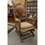 A beech-framed American rocker with Art Nouveau style incised decoration