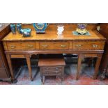 A late Georgian/Regency rosewood cross-banded mahogany sideboard with three frieze drawers,