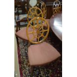 A set of twelve dining chairs with openwork satinwood-veneered oval backs,