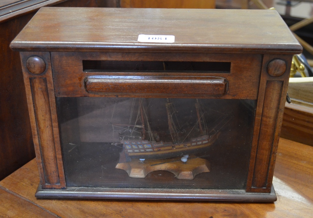 An antique mahogany table top posting box,