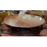 A good quality modern mahogany Jupes extending circular dining table,