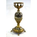 An Indian metalwork lamp stand decorated with a 'Tree of Life' style design,