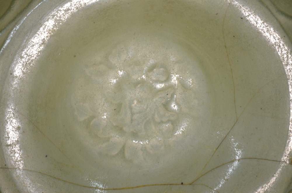 A Ming celadon dish of circular form, decorated at the centre with a floral spray, - Image 5 of 6