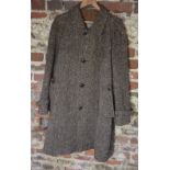 An Aquascutum herringbone Irish wool tweed gentleman's overcoat with 'football' leather buttons and