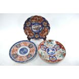 Three Japanese Imari dishes, including one of kikugata form with green enamel,