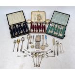 Two cased sets of six silver teaspoons and a cased set of .