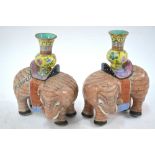 A pair of famille rose elephants,