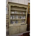 A part 18th century French open dresser/bookcase with twin cupboards to the base,