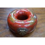 A red lacquer 'bead box' of circular form with hinged cover, decorated with a dragon and a phoenix,