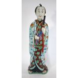 A Japanese Arita, or other centre of production, figure of a standing Samurai,