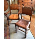 A set of six Jacobean style oak dining chairs with leather backs and seats,