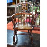 A 19th century yew and elm child's Windsor armchair,