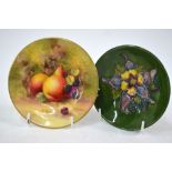 A small Moorcroft bowl, green ground decorated with a clematis flower,