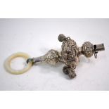 A late Victorian silver baby's rattle with mother-of-pearl teething ring, six bells and whistle,