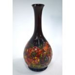 A Moorcroft flambe ovoid vase with tall flared neck decorated in the anemone pattern,