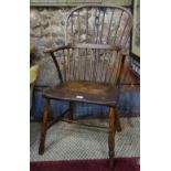A late 18th/19th century West Country hoop back elm seat Windsor chair,