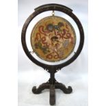 An Asian wood mounted, circular gong; decorated on the front and back with playful Buddhistic Lions,