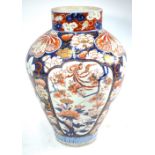 A large Imari oviform vase with cylindrical neck, decorated in underglaze blue, orange,