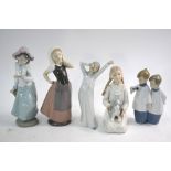 Five Nao figures - Girl with dove, 23 cm h.; Two choir boys, 17 cm.; Peasant Girl, 23.5 cm.