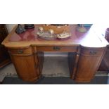An Art Deco style oak kneehole desk,