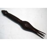 A Polynesian Ceremonial Cannibal fork, turned wood with berry-like finial,